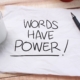 Aufschrift Words have Power auf Papier | Preisverhandlung